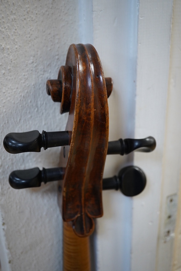 An early to mid 19th century German cello, attributed to Simon Voigt, Simon Voigt label inside with indistinct date, body 74.5cm, with a hard case. Condition - fair to good.